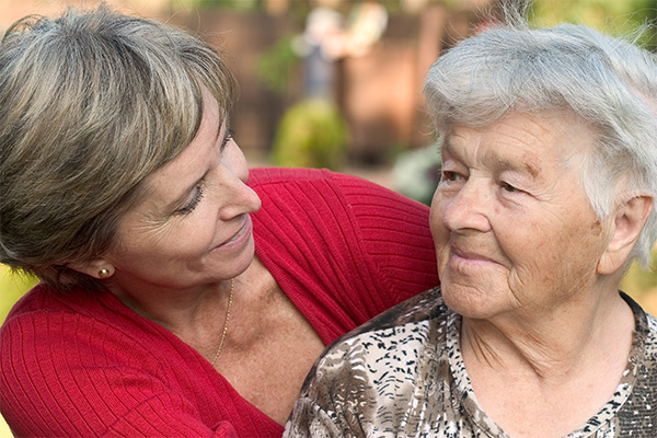 Younger woman looking at older woman